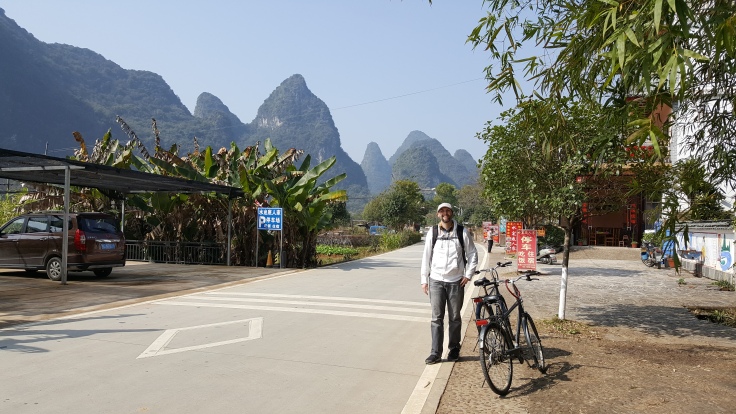 Yangshuo, China karst mountains behind bike on road